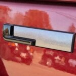 Gloss Black "L" Liftgate Badge from the 2021-2026 Grand Cherokee L