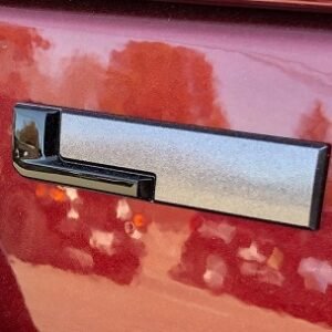 Gloss Black "L" Liftgate Badge from the 2021-2026 Grand Cherokee L